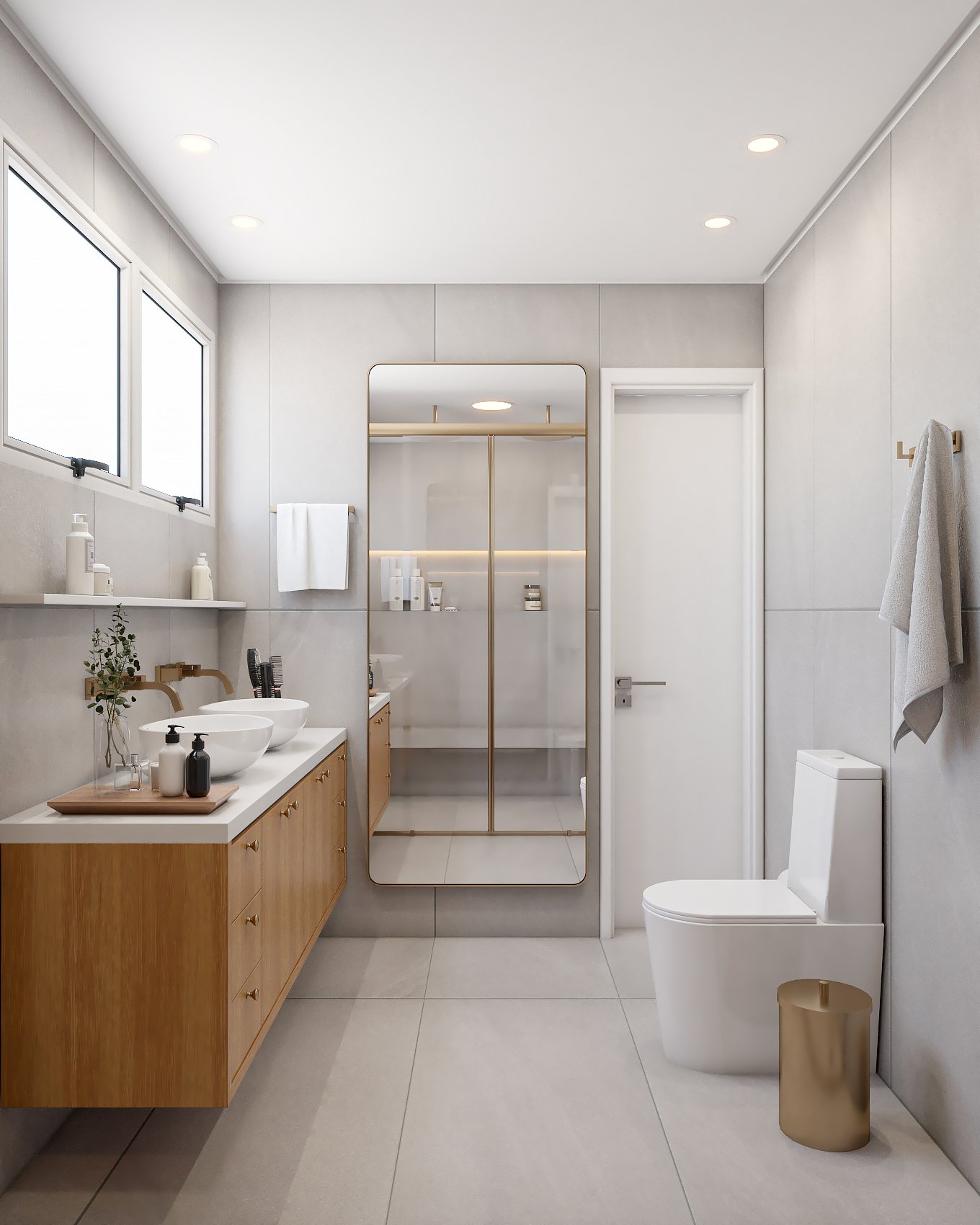 Minimalist bathroom with wood vanity, gold-framed shower, and clean white tile walls.